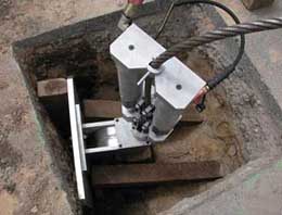 Pipe bursting machine set in one of two (start and finish) excavated pits